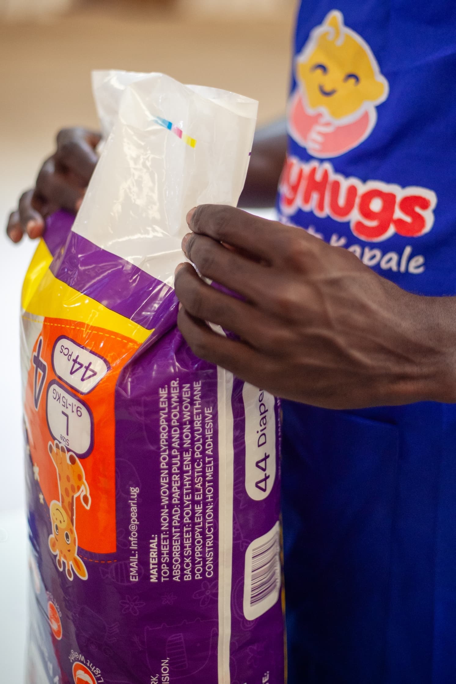 A Tiny Hugs Baby Pants Kapale pack being opened on the packing line